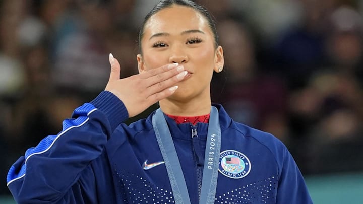 Sunisa Lee of the United States reacts after winning the bronze medal on the second day of gymnastics event finals during the Paris 2024 Olympic Summer Games.