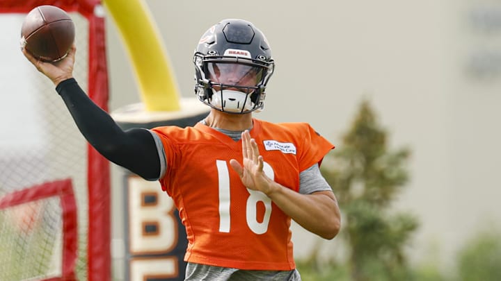 Caleb Williams throws on the run prior to training camp practice.