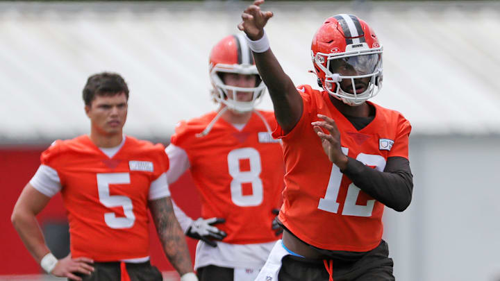 Browns quarterback Shedeur Sanders throws as QBs Dillon Gabriel (5) and Kenny Pickett look on during minicamp, Tuesday, June 10, 2025, in Berea.