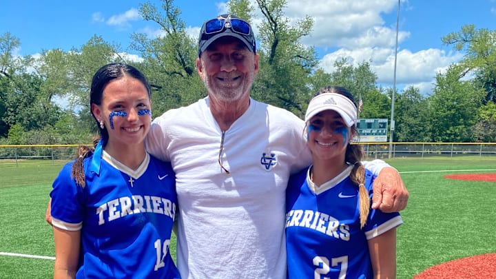 Hays Rutledge (left) and Abby Aguillard with Vandebilt Catholic coach James Spearman