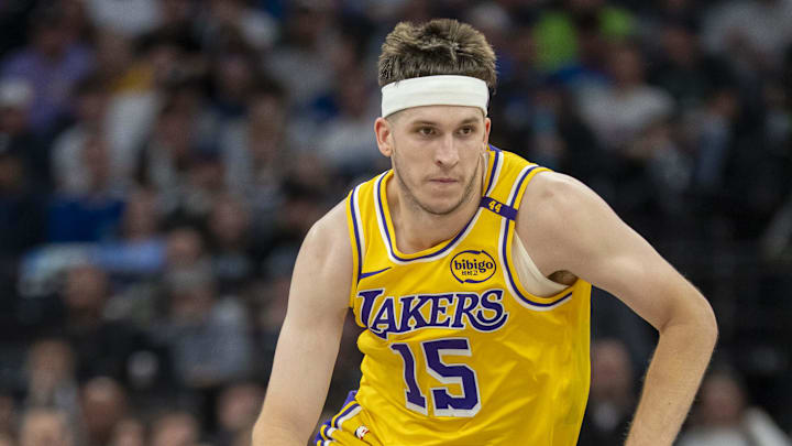 Apr 25, 2025; Minneapolis, Minnesota, USA; Los Angeles Lakers guard Austin Reaves (15) dribbles the ball against the Minnesota Timberwolves in the second half during game three of first round for the 2024 NBA Playoffs at Target Center. Mandatory Credit: Jesse Johnson-Imagn Images
