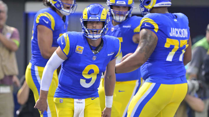 Oct 8, 2023; Inglewood, California, USA; Los Angeles Rams quarterback Matthew Stafford (9) celebrates after a touchdown by wide receiver Puka Nacua (17) in the first half against the Philadelphia Eagles at SoFi Stadium.