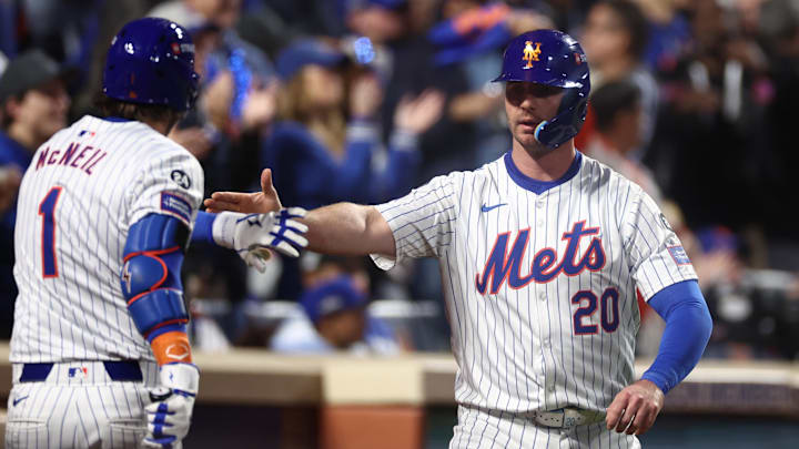 Oct 18, 2024; New York City, New York, USA; New York Mets first baseman Pete Alonso (20) celebrates scoring on an RBI from right fielder Starling Marte (6, not pictured) with New York Mets second baseman Jeff McNeil (1) during the eighth inning against the Los Angeles Dodgers during game five of the NLCS for the 2024 MLB playoffs at Citi Field. Oct 18, 2024; New York City, New York, USA; New York Mets first baseman Pete Alonso (20) celebrates scoring on an RBI from right fielder Starling Marte (6, not pictured) with New York Mets second baseman Jeff McNeil (1) during the eighth inning against the Los Angeles Dodgers during game five of the NLCS for the 2024 MLB playoffs at Citi Field.