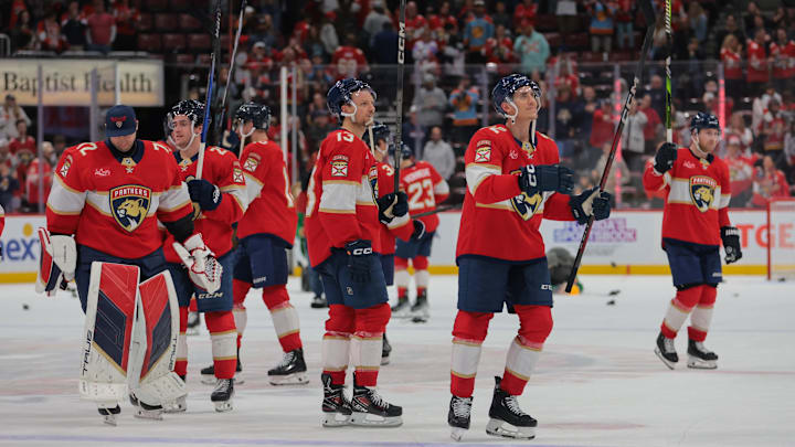 Nov 30, 2024; Sunrise, Florida, USA; Florida Panthers left wing Tomas Nosek (92) and center Sam Reinhart (13) celebrate after the gameagainst the Carolina Hurricanes at Amerant Bank Arena. Mandatory Credit: Sam Navarro-Imagn Images