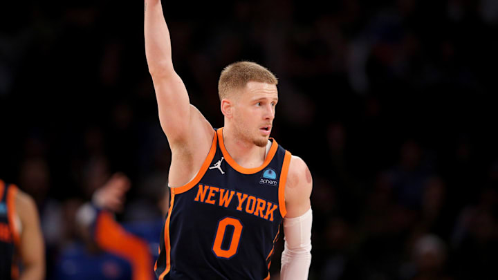 Jan 30, 2024; New York, New York, USA; New York Knicks guard Donte DiVincenzo (0) celebrates his three point shot against the Utah Jazz during the third quarter at Madison Square Garden. Mandatory Credit: Brad Penner-Imagn Images