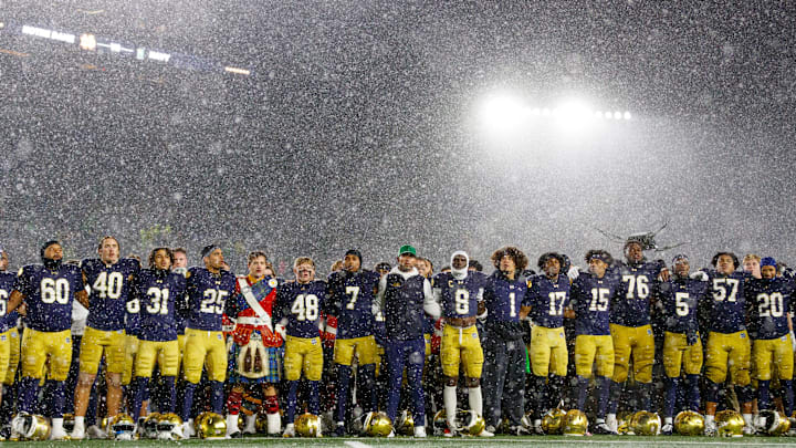 Notre Dame head coach Marcus Freeman, center, celebrates with his players after winning a NCAA football game 49-10 against Navy at Notre Dame Stadium on Saturday, Nov. 8, 2025, in South Bend.