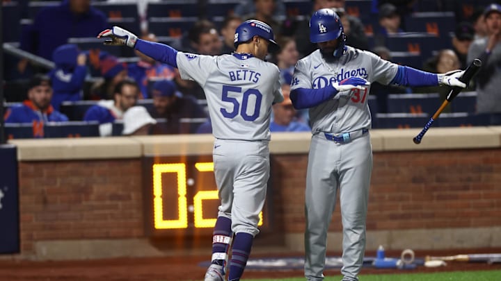 Oct 18, 2024; New York City, New York, USA; Los Angeles Dodgers right fielder Mookie Betts (50) celebrates a solo home run with left fielder Teoscar Hernández (37) during the sixth inning against the New York Mets during game five of the NLCS for the 2024 MLB playoffs at Citi Field. Mandatory Credit: Vincent Carchietta-Imagn Images Oct 18, 2024; New York City, New York, USA; Los Angeles Dodgers right fielder Mookie Betts (50) celebrates a solo home run with left fielder Teoscar Hernández (37) during the sixth inning against the New York Mets during game five of the NLCS for the 2024 MLB playoffs at Citi Field. Mandatory Credit: Vincent Carchietta-Imagn Images
