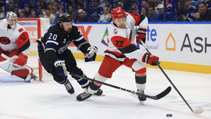 Dec 18, 2025; Tampa, Florida, USA;Carolina Hurricanes center Logan Stankoven (22) skates with the puck as Tampa Bay Lightning left wing Nick Paul (20) defends during the first period at Benchmark International Arena. Mandatory Credit: Kim Klement Neitzel-Imagn Images Dec 18, 2025; Tampa, Florida, USA;Carolina Hurricanes center Logan Stankoven (22) skates with the puck as Tampa Bay Lightning left wing Nick Paul (20) defends during the first period at Benchmark International Arena. Mandatory Credit: Kim Klement Neitzel-Imagn Images