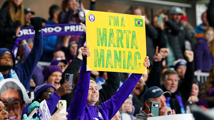 Orlando Pride fans celebrate after winning the 2024 NWSL Championship match at CPKC Stadium.