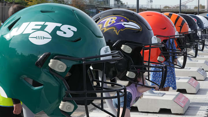 Oct 7, 2023; London, United Kingdom; Large oversized helmets of the New York Jets Baltimore Ravens, Cleveland Browns and Cincinnati Bengals at the NFL Experience London at the Battersea Power Station. Mandatory Credit: Kirby Lee-Imagn Images