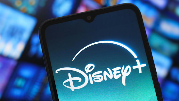 In this photo illustration, the Disney Plus logo is seen...