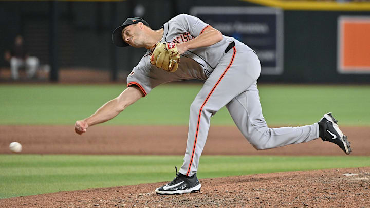 Jun 30, 2025; Phoenix, Arizona, USA;  San Francisco Giants pitcher Tyler Rogers (71) throws in the eighth inning against the Arizona Diamondbacks at Chase Field.