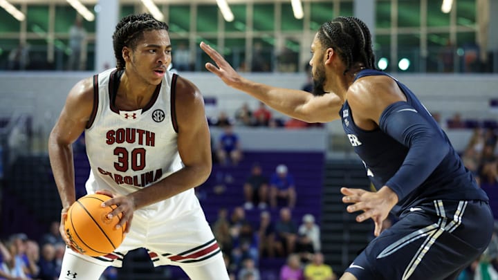 Nov 25, 2024; Fort Myers, Florida, USA; South Carolina Gamecocks forward Collin Murray-Boyles (30) is guarded by Xavier Musketeers forward Jerome Hunter (2) in the second half  at Suncoast Credit Union Arena. Mandatory Credit: Nathan Ray Seebeck-Imagn Images