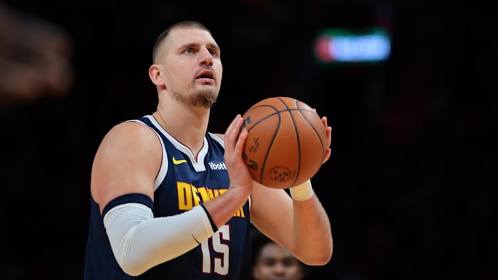 Dec 29, 2025; Miami, Florida, USA; Denver Nuggets center Nikola Jokic (15) shoots a free throw against the Miami Heat during the first quarter at Kaseya Center.