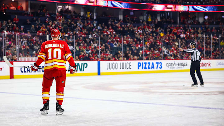 Jan 5, 2026; Calgary, Alberta, CAN; Calgary Flames left wing Jonathan Huberdeau (10) takes a penalty shot against the Seattle Kraken during the first period at Scotiabank Saddledome. Mandatory Credit: Sergei Belski-Imagn Images