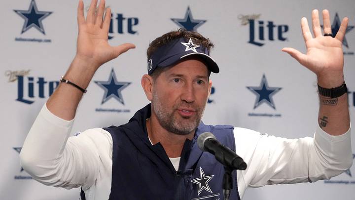 Dallas Cowboys head coach Brian Schottenheimer reacts at press conference at the Clube de Regatas do Flamengo training ground. Dallas Cowboys head coach Brian Schottenheimer reacts at press conference at the Clube de Regatas do Flamengo training ground.