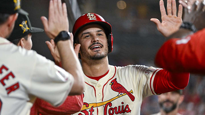 May 18, 2024; St. Louis, Missouri, USA;  St. Louis Cardinals third baseman Nolan Arenado (28) is congratulated by teammates after scoring against the Boston Red Sox during the eighth inning at Busch Stadium. Mandatory Credit: Jeff Curry-Imagn Images