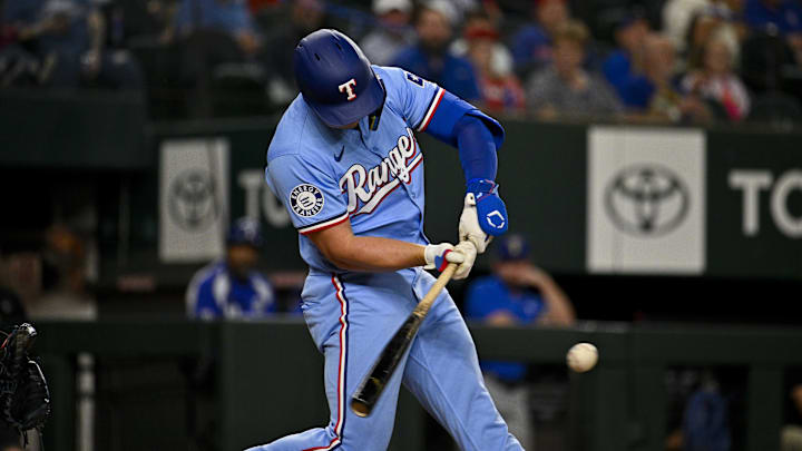 Apr 7, 2024; Arlington, Texas, USA; Texas Rangers pinch hitter Justin Foscue (56) gets his first career MLB hit and run batted in during the ninth inning against the Houston Astros at Globe Life Field. Apr 7, 2024; Arlington, Texas, USA; Texas Rangers pinch hitter Justin Foscue (56) gets his first career MLB hit and run batted in during the ninth inning against the Houston Astros at Globe Life Field.