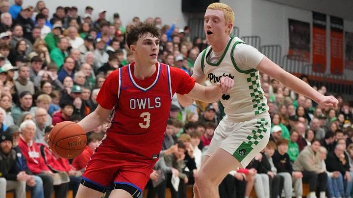 Slinger's Jack Kohnen (3) breaks past Port Washington's Grady Karrels (2) during the WIAA D2 sectional semifinal game at Cedarburg High School in Cedarburg, Wisconsin, March 12, 2026. Slinger won the game, 62-33.