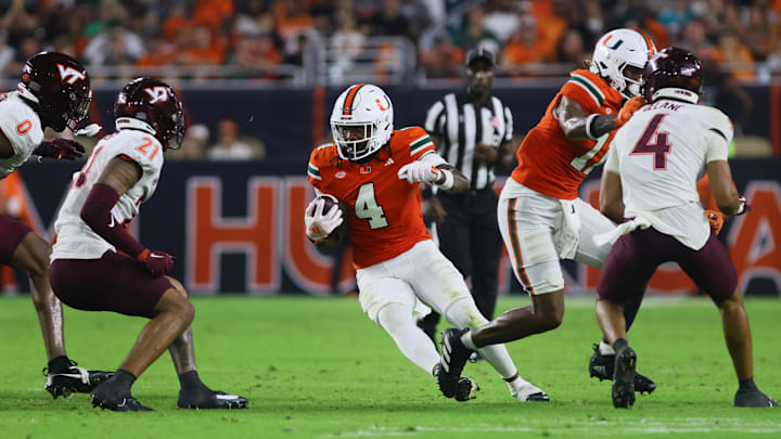 Sep 27, 2024; Miami Gardens, Florida, USA; Miami Hurricanes running back Mark Fletcher Jr. (4) runs with the football against the Virginia Tech Hokies during the third quarter at Hard Rock Stadium. Mandatory Credit: Sam Navarro-Imagn Images