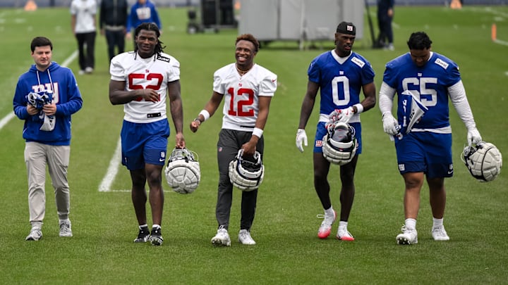 May 9, 2026; East Rutherford, NJ, USA; New York Giants rookies Arvell Reese (52), Colton Hood (12), Malachi Fields (0) and Francis Mauigoa (65) walk off the field after rookie minicamp at Quest Diagnostics Training Center.  