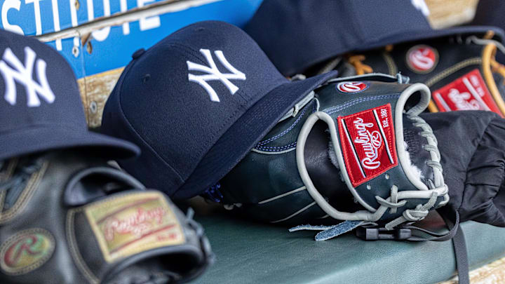 Apr 7, 2025; Detroit, Michigan, USA; New York Yankees baseball hats and gloves in the dugout out in the eighth inning against the Detroit Tigers at Comerica Park. Mandatory Credit: David Reginek-Imagn Images