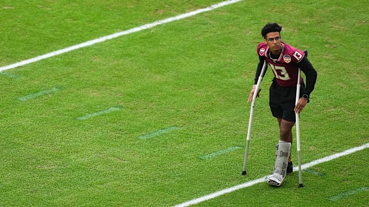 Dec 30, 2023; Miami Gardens, FL, USA; Florida State Seminoles quarterback Jordan Travis (13) before the 2023 Orange Bowl against the Georgia Bulldogs at Hard Rock Stadium. Mandatory Credit: Jasen Vinlove-Imagn Images