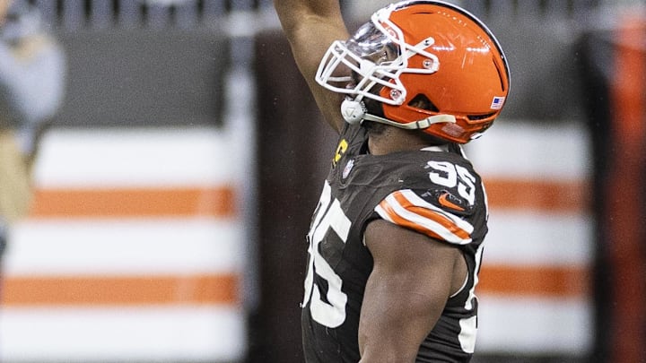 Dec 29, 2024; Cleveland, Ohio, USA; Cleveland Browns defensive end Myles Garrett (95) celebrates his sack against the Miami Dolphins during the third quarter at Huntington Bank Field. Mandatory Credit: Scott Galvin-Imagn Images