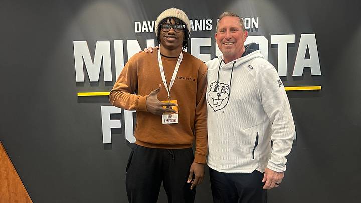 Ifeanyi Emedobi with Gophers rush ends coach Steve Stanard on an unofficial visit. Ifeanyi Emedobi with Gophers rush ends coach Steve Stanard on an unofficial visit.