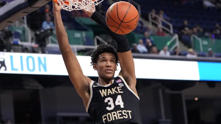 Mar 8, 2023; Greensboro, NC, USA; Wake Forest Demon Deacons forward Bobi Klintman (34) scores in the first half of the second round at Greensboro Coliseum. Mandatory Credit: Bob Donnan-USA TODAY Sports Mar 8, 2023; Greensboro, NC, USA; Wake Forest Demon Deacons forward Bobi Klintman (34) scores in the first half of the second round at Greensboro Coliseum. Mandatory Credit: Bob Donnan-USA TODAY Sports