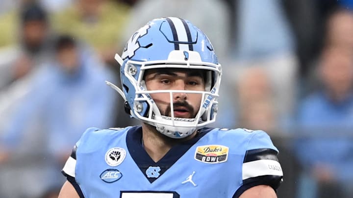Dec 30, 2021; Charlotte, NC, USA; North Carolina Tar Heels quarterback Sam Howell (7) looks to pass in the second quarter during the 2021 Duke's Mayo Bowl at Bank of America Stadium. 