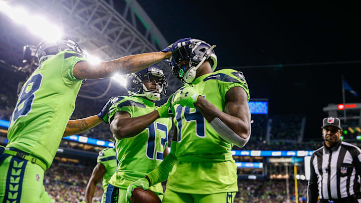 Oct 7, 2021; Seattle, Washington, USA; Seattle Seahawks wide receiver DK Metcalf (14) celebrates with wide receiver Freddie Swain (18) and wide receiver Phillip Dorsett (13) after catching a touchdown against the Los Angeles Rams during the fourth quarter at Lumen Field. Mandatory Credit: Joe Nicholson-Imagn Images Oct 7, 2021; Seattle, Washington, USA; Seattle Seahawks wide receiver DK Metcalf (14) celebrates with wide receiver Freddie Swain (18) and wide receiver Phillip Dorsett (13) after catching a touchdown against the Los Angeles Rams during the fourth quarter at Lumen Field. Mandatory Credit: Joe Nicholson-Imagn Images