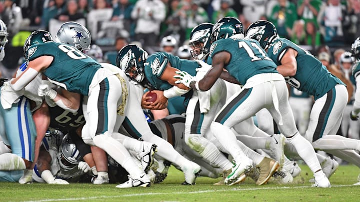Nov 5, 2023; Philadelphia, Pennsylvania, USA; Philadelphia Eagles quarterback Jalen Hurts (1) picks up yardage a first down with a push from wide receiver A.J. Brown (11) and tight end Dallas Goedert (88) against the Dallas Cowboys at Lincoln Financial Field. Mandatory Credit: Eric Hartline-Imagn Images