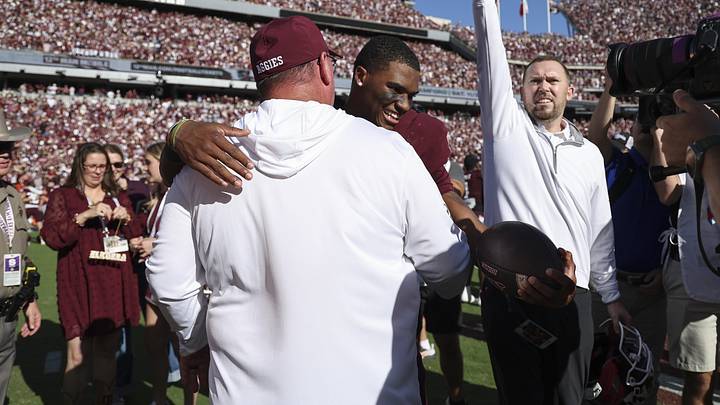 Texas A&M Aggies quarterback Marcel Reed (10) embraces head coach Mike Elko after the game against the South Carolina Gamecocks at Kyle Field. Texas A&M Aggies quarterback Marcel Reed (10) embraces head coach Mike Elko after the game against the South Carolina Gamecocks at Kyle Field.