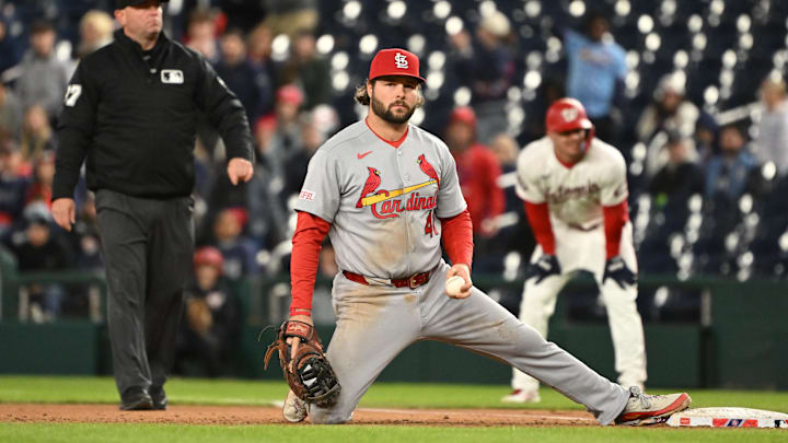 Apr 7, 2026; Washington, District of Columbia, USA; St. Louis Cardinals first baseman Alec Burleson (41) rests on first base after Washington Nationals center fielder Jacob Young (30) is thrown out during the tenth inning at Nationals Park. Mandatory Credit: Rafael Suanes-Imagn Images