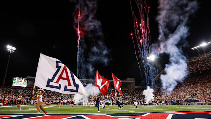 Aug 31, 2024; Tucson, Arizona, USA; Arizona Wildcats mascot Wilbur and Arizona Wildcats cheerleaders lead the Arizona Wildcats football team onto the field at the beginning of the game at Arizona Stadium. Mandatory Credit: Aryanna Frank.