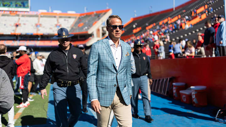 Nov 23, 2024; Gainesville, Florida, USA; Mississippi Rebels head coach Lane Kiffin walks off the field before a game against the Florida Gators at Ben Hill Griffin Stadium. Mandatory Credit: Matt Pendleton-Imagn Images
