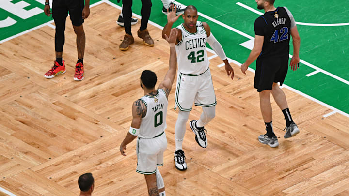 Jun 6, 2024; Boston, Massachusetts, USA; Boston Celtics center Al Horford (42) high fives forward Jayson Tatum (0) after a play against the Dallas Mavericks during the third quarter of game one of the 2024 NBA Finals at TD Garden. Mandatory Credit: Peter Casey-Imagn Images