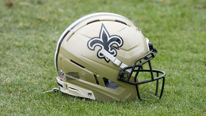 Aug 14, 2025; Carson, CA, USA; A New Orleans Saints helmet on the field during a joint practice against the Los Angeles Rams at the Dignity Health Sports Park. Mandatory Credit: Kirby Lee-Imagn Images