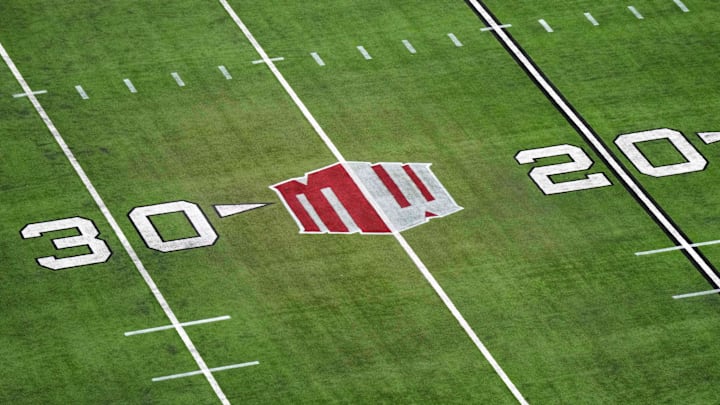 The Mountain West conference logo on the field at Allegiant Stadium. Mandatory Credit: Kirby Lee-Imagn Images