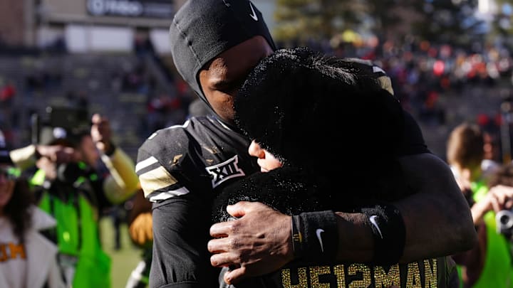 Colorado Buffaloes wide receiver Travis Hunter hugs his girlfriend following the win against the Oklahoma State Cowboys.