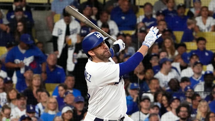 Los Angeles Dodgers designated hitter J.D. Martinez (28) hits a home run against the Arizona