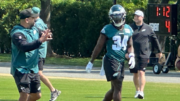 Former Eagles RB Montrell Johnson gets instruction from position coach Jemal Singleton.