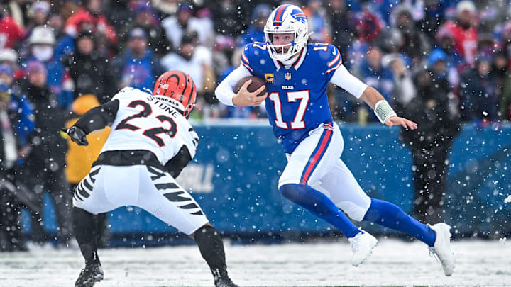 Dec 7, 2025; Orchard Park, New York, USA; Buffalo Bills quarterback Josh Allen (17) tries to avoid a tackle by Cincinnati Bengals safety Geno Stone (22) in the third quarter at Highmark Stadium. Mandatory Credit: Mark Konezny-Imagn Images Dec 7, 2025; Orchard Park, New York, USA; Buffalo Bills quarterback Josh Allen (17) tries to avoid a tackle by Cincinnati Bengals safety Geno Stone (22) in the third quarter at Highmark Stadium. Mandatory Credit: Mark Konezny-Imagn Images