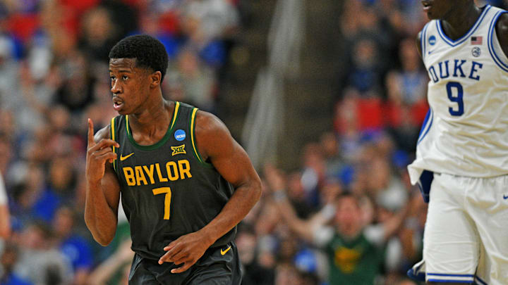 Mar 23, 2025; Raleigh, NC, USA; Baylor Bears guard VJ Edgecombe (7) reacts after a play as Duke Blue Devils center Khaman Maluach (9) looks on during the second half in the second round of the NCAA Tournament at Lenovo Center. Mandatory Credit: Zachary Taft-Imagn Images