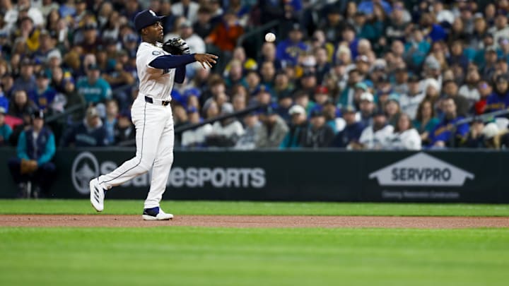 Seattle Mariners second baseman Ryan Bliss throws to first during a game against the Athletics on March 27 at T-Mobile Park. Seattle Mariners second baseman Ryan Bliss throws to first during a game against the Athletics on March 27 at T-Mobile Park.