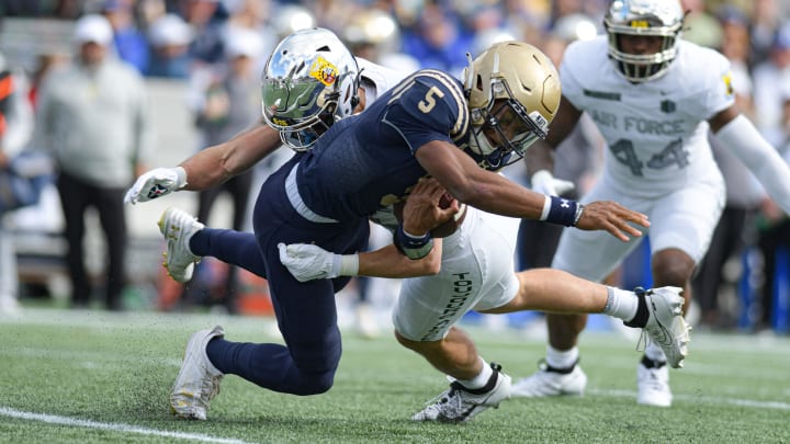 Oct 21, 2023; Annapolis, Maryland, USA; Air Force Falcons linebacker Alec Mock (40) tackles Navy Midshipmen quarterback Braxton Woodson (5) during the first half at Navy-Marine Corps Memorial Stadium. Mandatory Credit: Tommy Gilligan-USA TODAY Sports Oct 21, 2023; Annapolis, Maryland, USA; Air Force Falcons linebacker Alec Mock (40) tackles Navy Midshipmen quarterback Braxton Woodson (5) during the first half at Navy-Marine Corps Memorial Stadium. Mandatory Credit: Tommy Gilligan-USA TODAY Sports