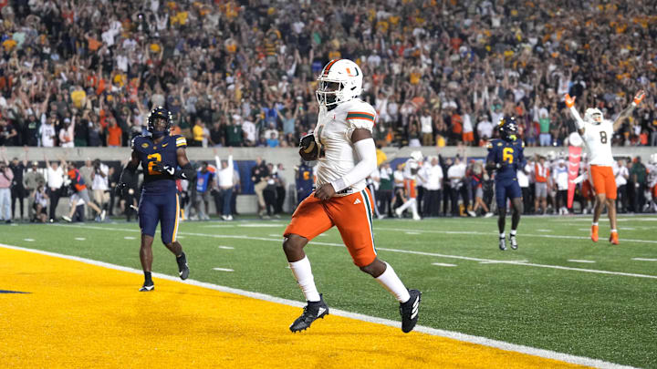 Oct 5, 2024; Berkeley, California, USA; Miami Hurricanes quarterback Cam Ward (1) rushes for a touchdown against the California Golden Bears during the fourth quarter at California Memorial Stadium. Mandatory Credit: Darren Yamashita-Imagn Images Oct 5, 2024; Berkeley, California, USA; Miami Hurricanes quarterback Cam Ward (1) rushes for a touchdown against the California Golden Bears during the fourth quarter at California Memorial Stadium. Mandatory Credit: Darren Yamashita-Imagn Images