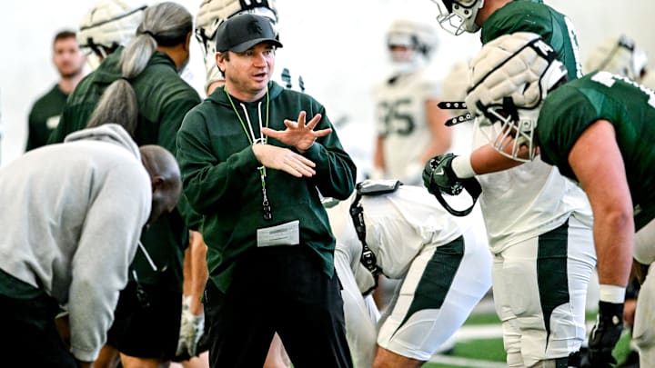 Michigan State's head coach Jonathan Smith, left, talks with Justin Bell during football practice on Tuesday, April 8, 2025, in East Lansing.