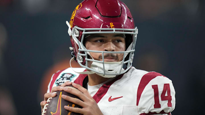 Dec 27, 2024; Las Vegas, NV, USA; Southern California Trojans quarterback Jayden Maiava (14) throws the ball against the Texas A&M Aggies in the first half at Allegiant Stadium. Mandatory Credit: Kirby Lee-Imagn Images